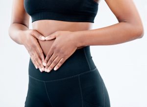 woman with heart over stomach